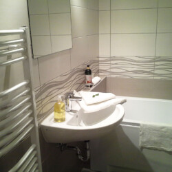 Bathroom with bathtub and shower